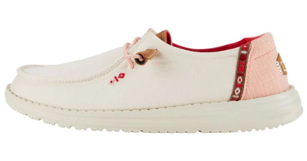 White adult Hey Dude shoe with pink heel and pink and red accents