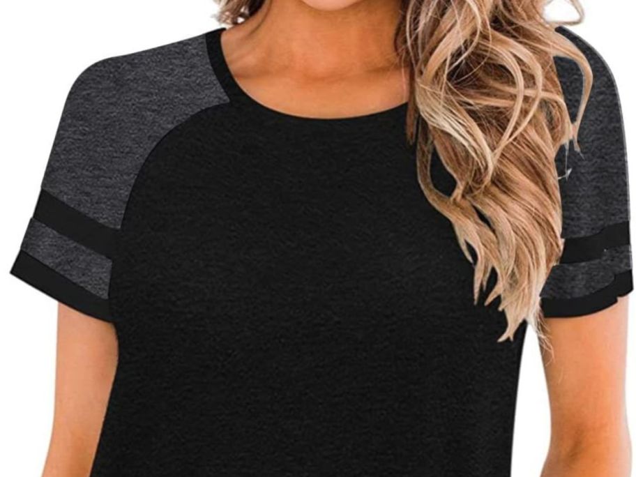 A woman wearing a Heymiss Womens Casual Tunic Top in black