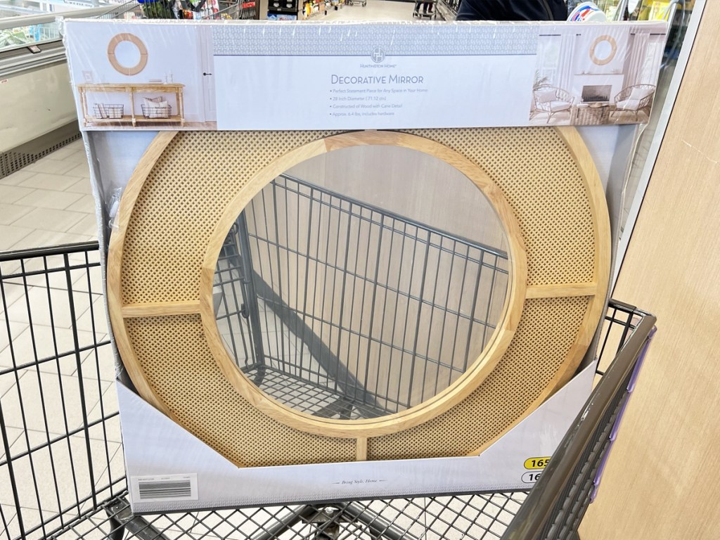 round wooden framed wall mirror in shopping cart