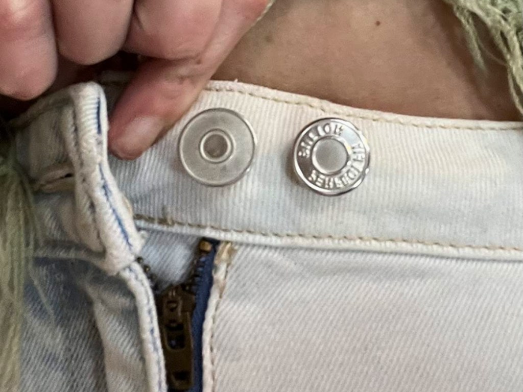 pair of jeans with button pin
