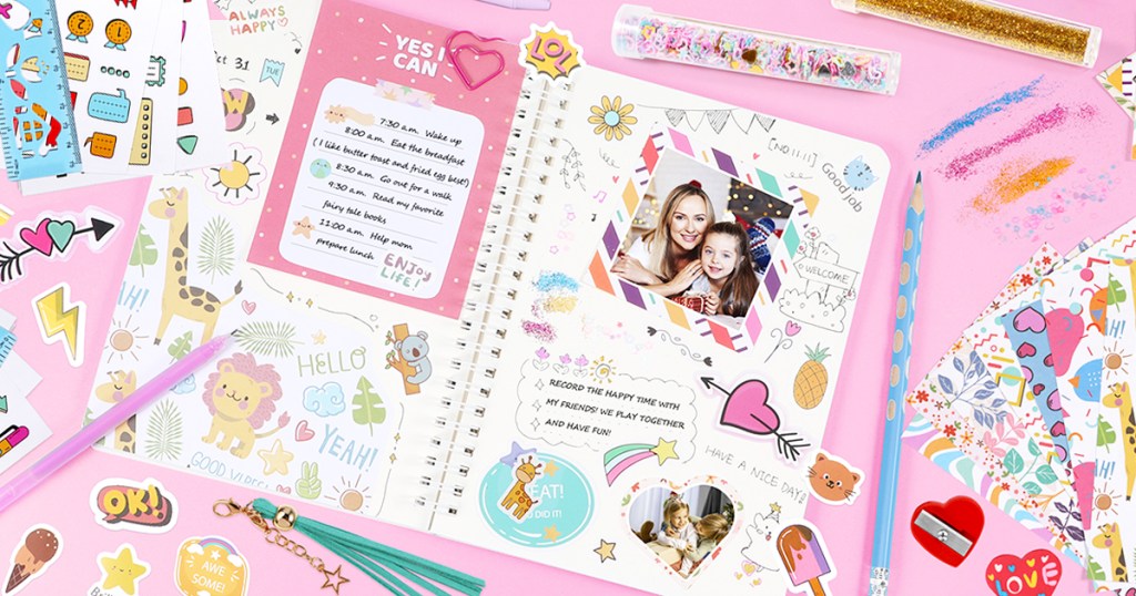 opened journal decorated with photos and stickers with stickers and supplies all around it