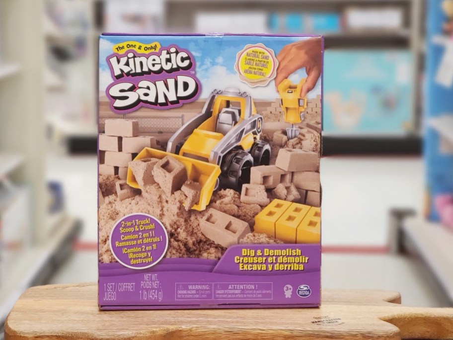 Kinetic Sand Dig & Demolish Playset on wood table in store