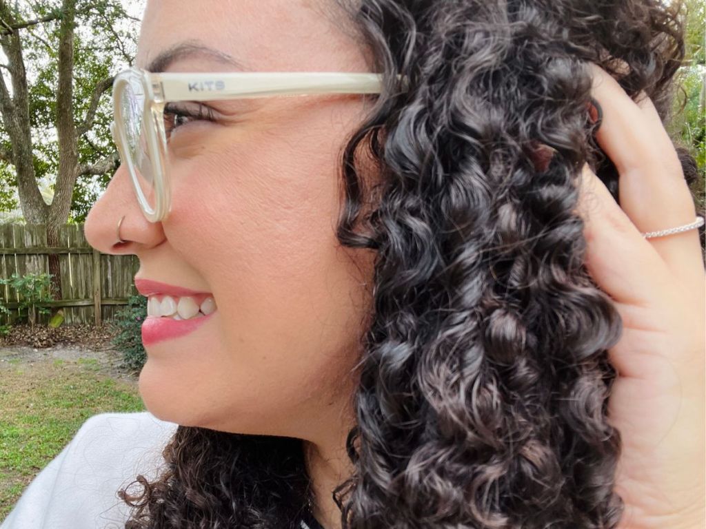 Profile of a woman wearing Kits glasses