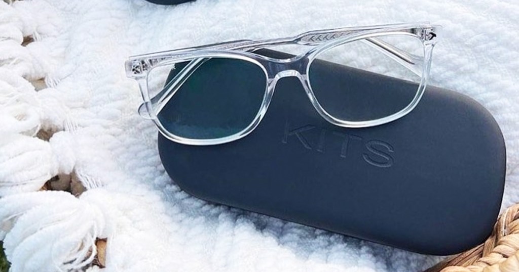 pair of clear glasses on top of a glasses case