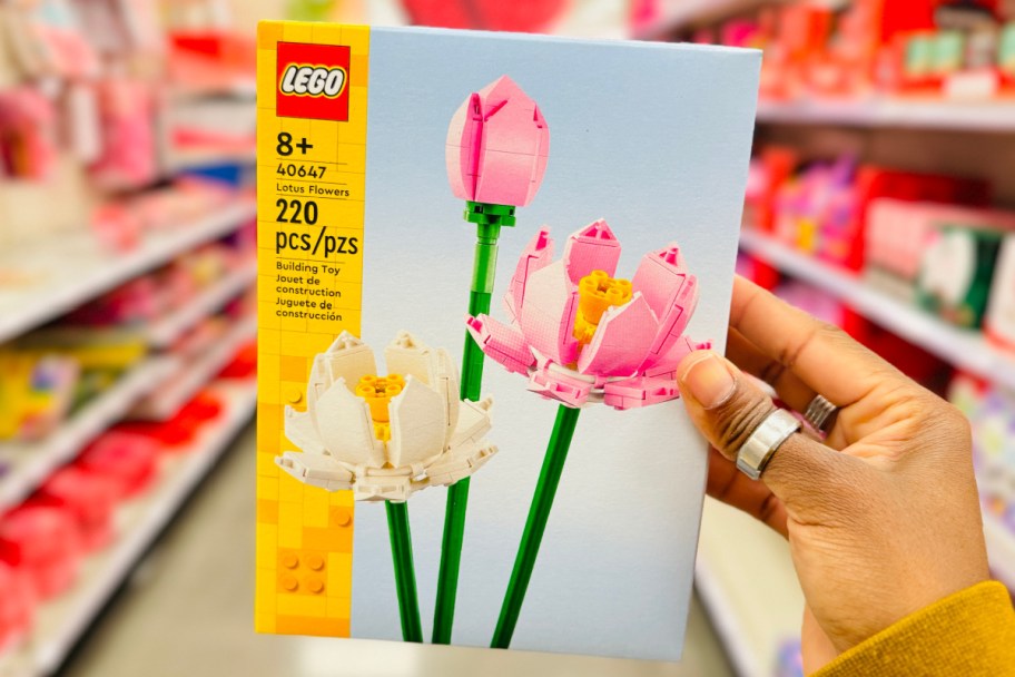 hand holding LEGO lotus flowers set in store