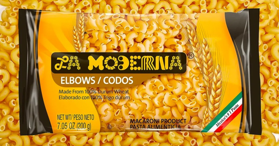 bag of La Moderna Elbow Pasta on top of dried elbow pasta