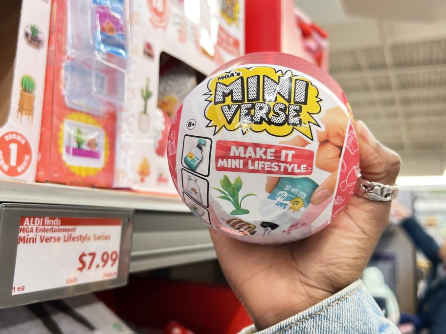 hand holding up a Mini Verse Lifestyle ball in store