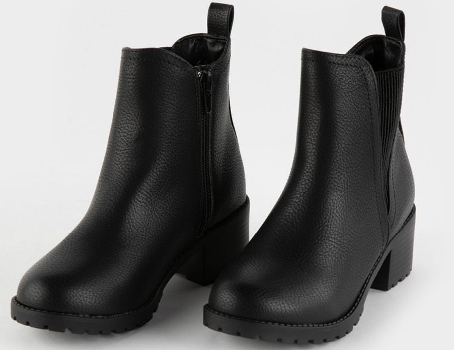 a pair of girls black chelsea boots