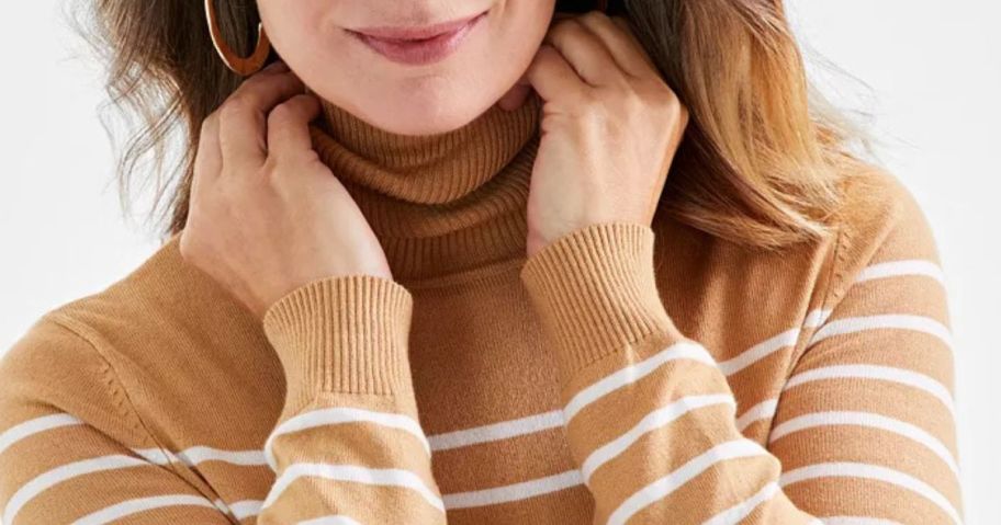 Woman wearing a Style & Co Women's Striped Turtleneck Sweater