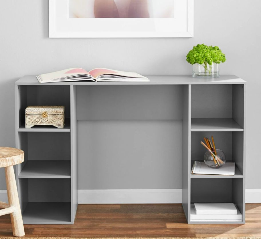 a gray work desk with 6 cube open storage