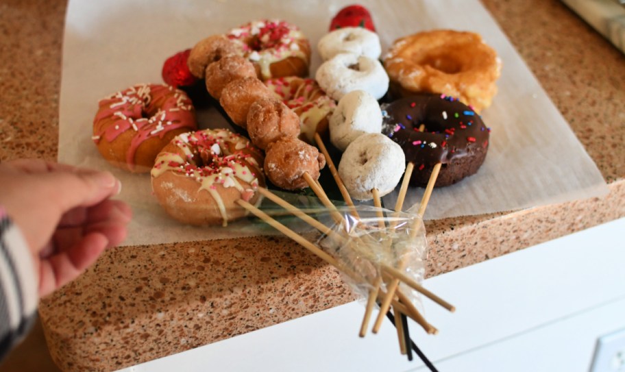 assembling a doughnut bouquet