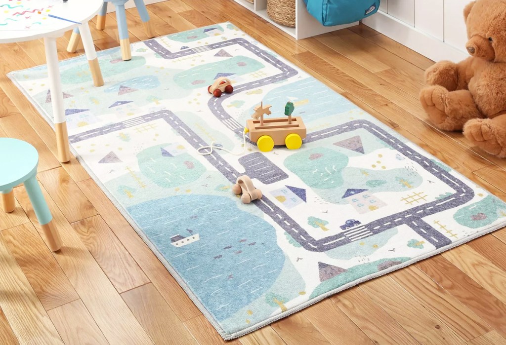 road and lakes print rug on playroom floor
