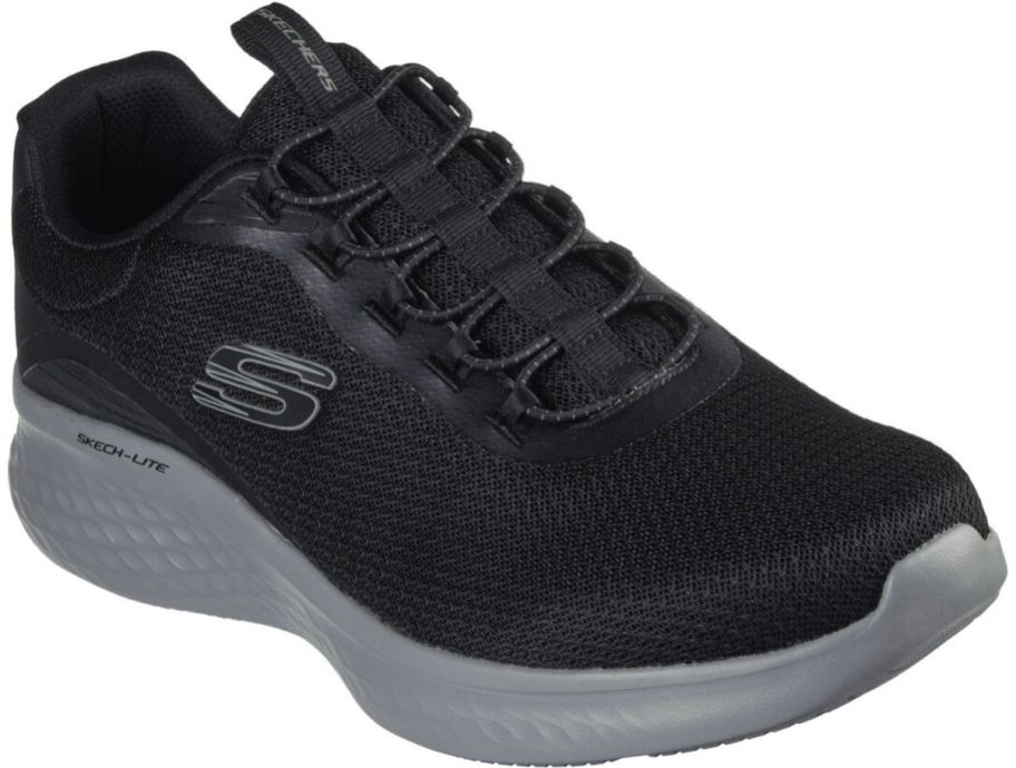 a mens black lace up walking shoe with a gray sole