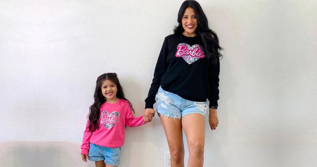 mom and daughter wearign Barbie sweatshirts