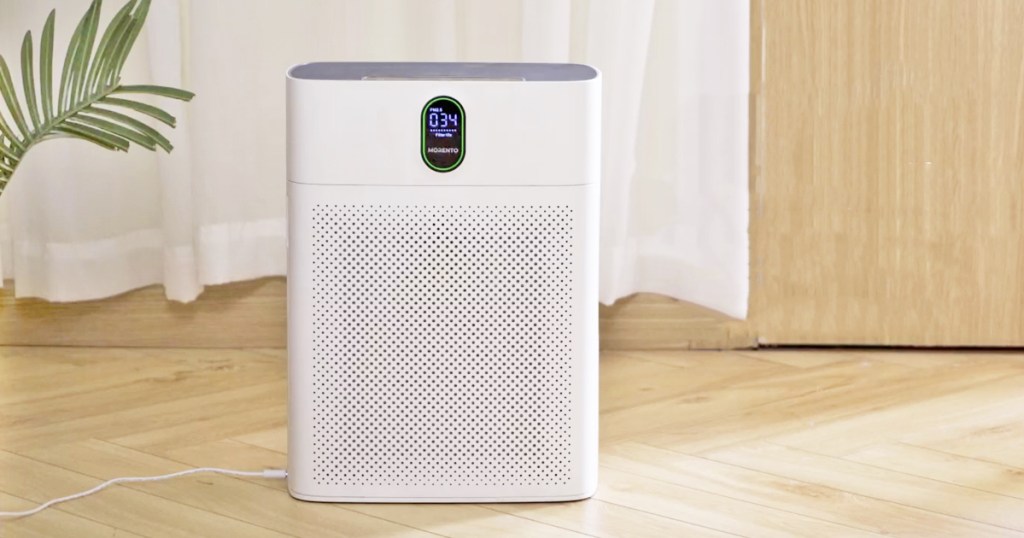 white air purifier on hardwood floor