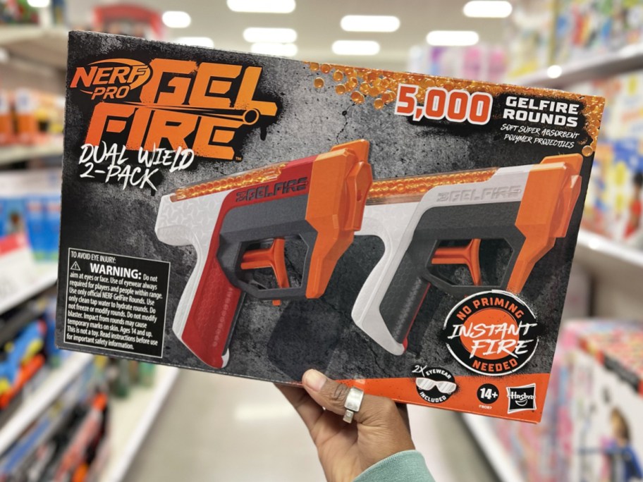 hand holding up box of 2 pack of nerf blasters in store