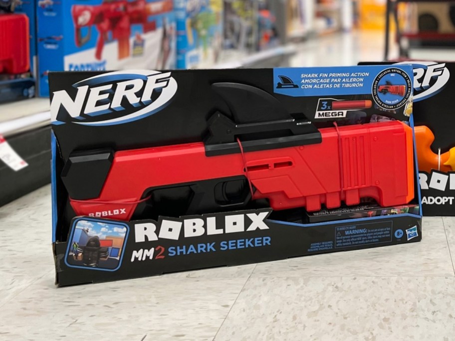 NERF Roblox MM2: Shark Seeker Dart Blaster box on floor in store