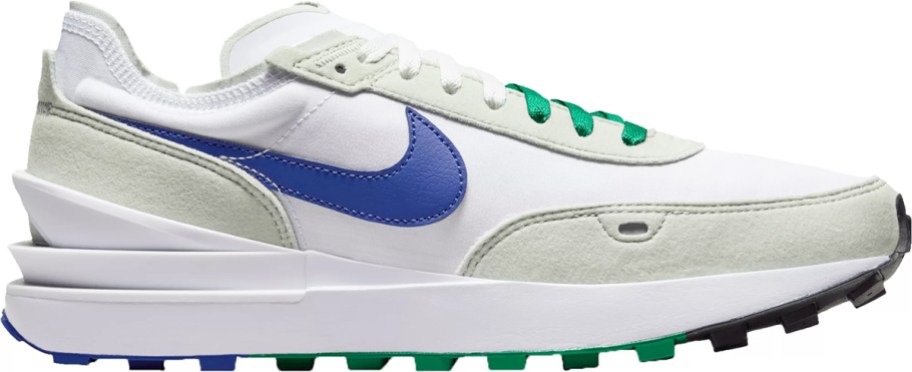 white, beige, blue, and green nike shoe