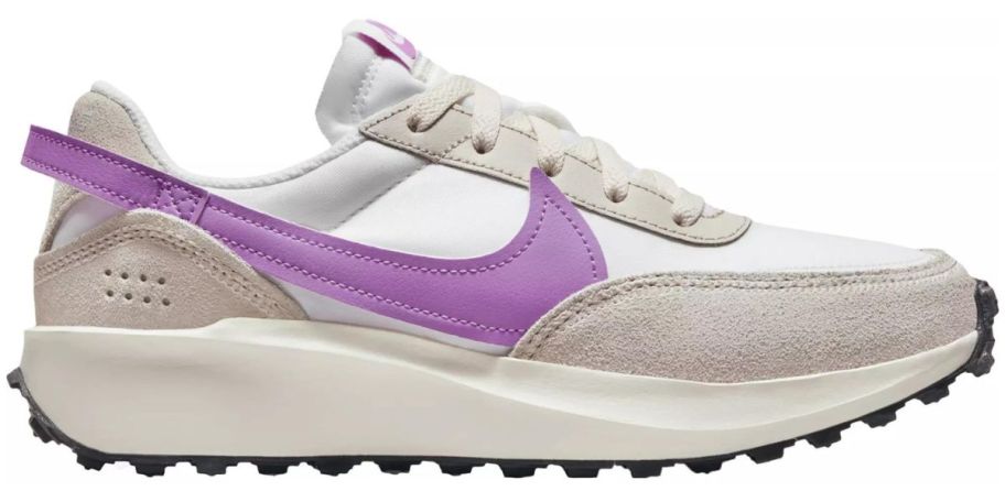 A Nike Women's Waffle Debut Shoe in white and purple 