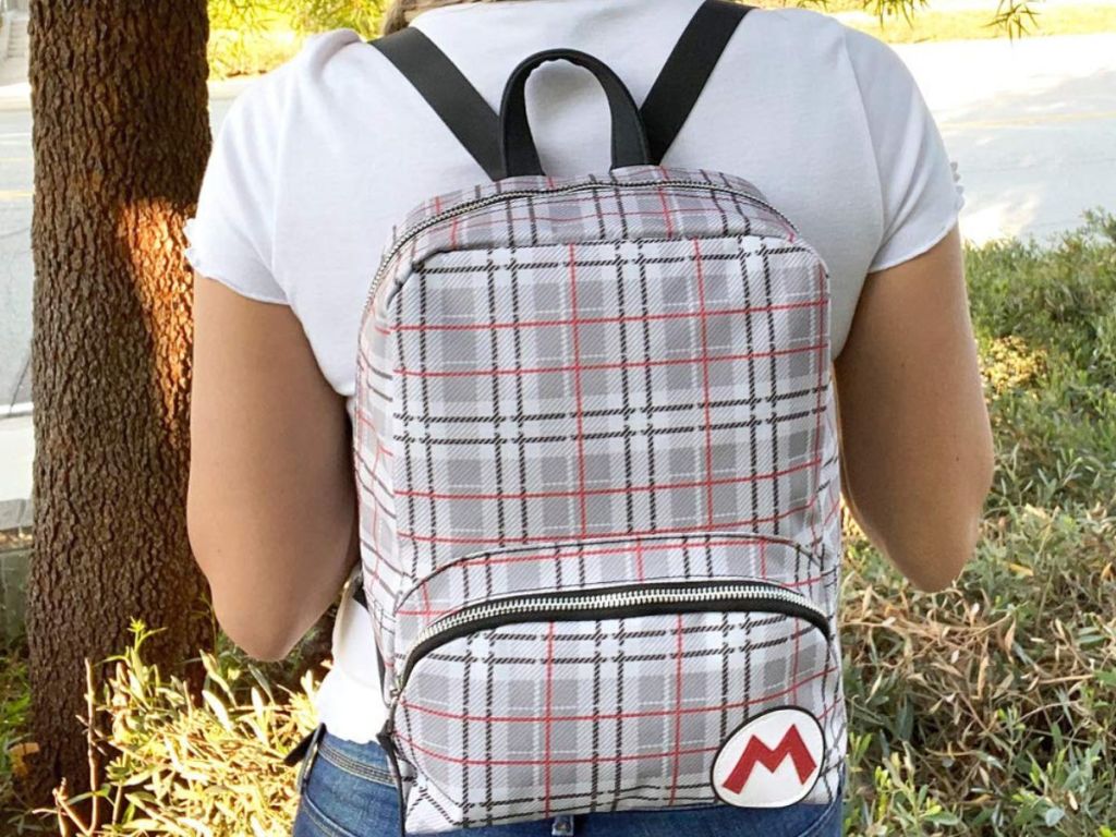 girl wearing Mario mini backpack