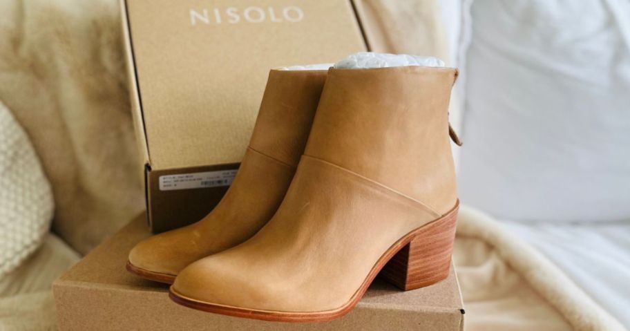 Nisolo Dari Boots propped up on the box they come in