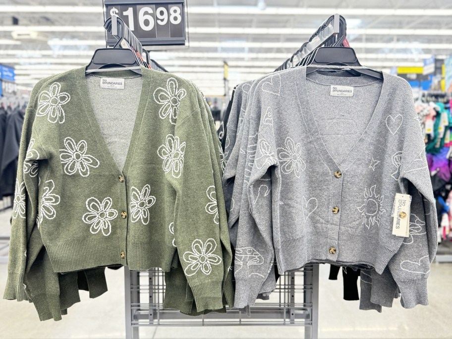 green and grey cropped cardigans on display rack in store