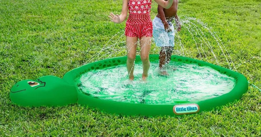 children in an inflatable turtle pool