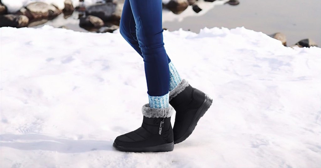 wearing black boots in the snow