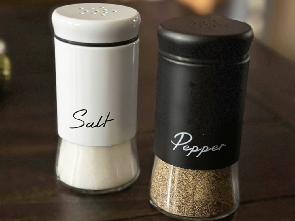set of black and white salt & pepper shakers on kitchen counter