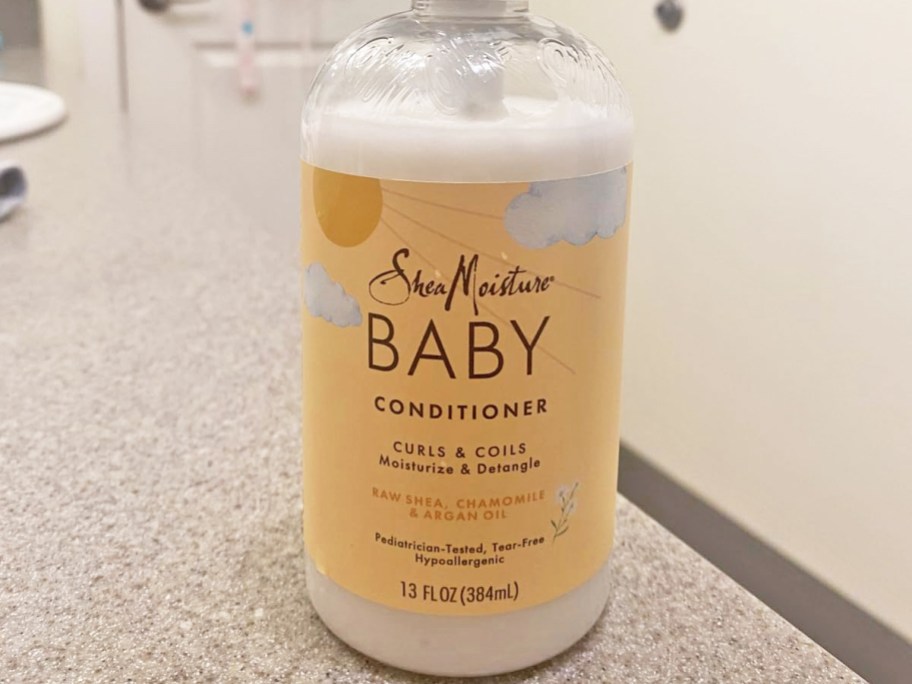 bottle of SheaMoisture Baby Conditioner on bathroom counter
