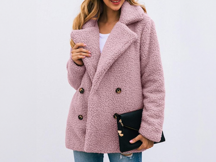 woman wearing a rose colored Sherpa Jacket with Buttons