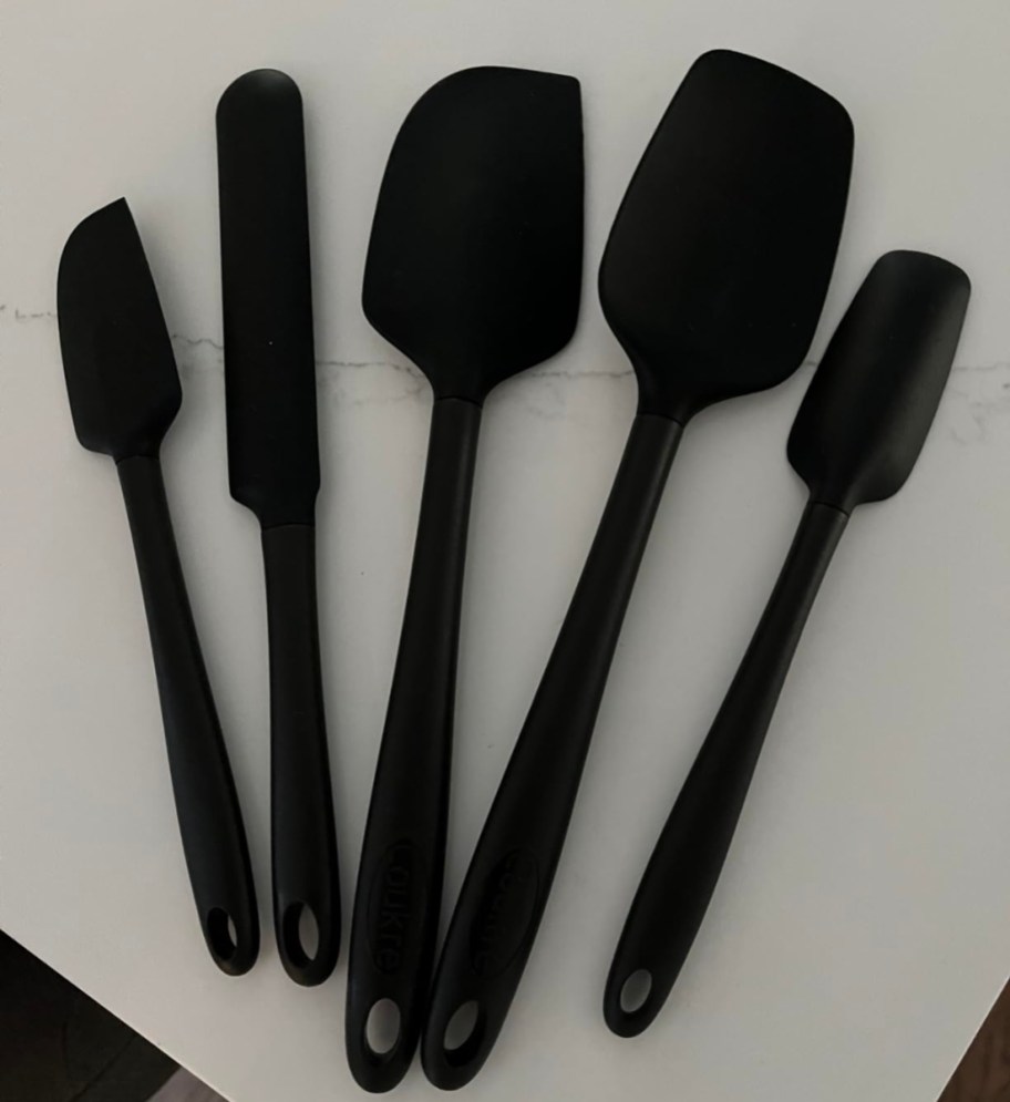Coukre Silicone Spatula 5-Piece Set in black on kitchen counter