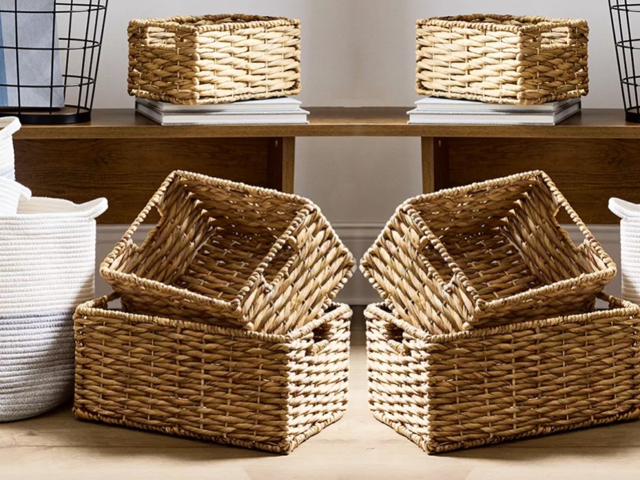 stacked wicker baskets near wood bench