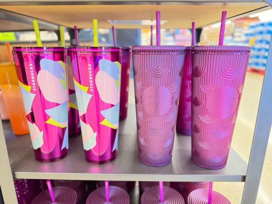 purple floral and solid purple magenta Starbucks cold cups on shelf