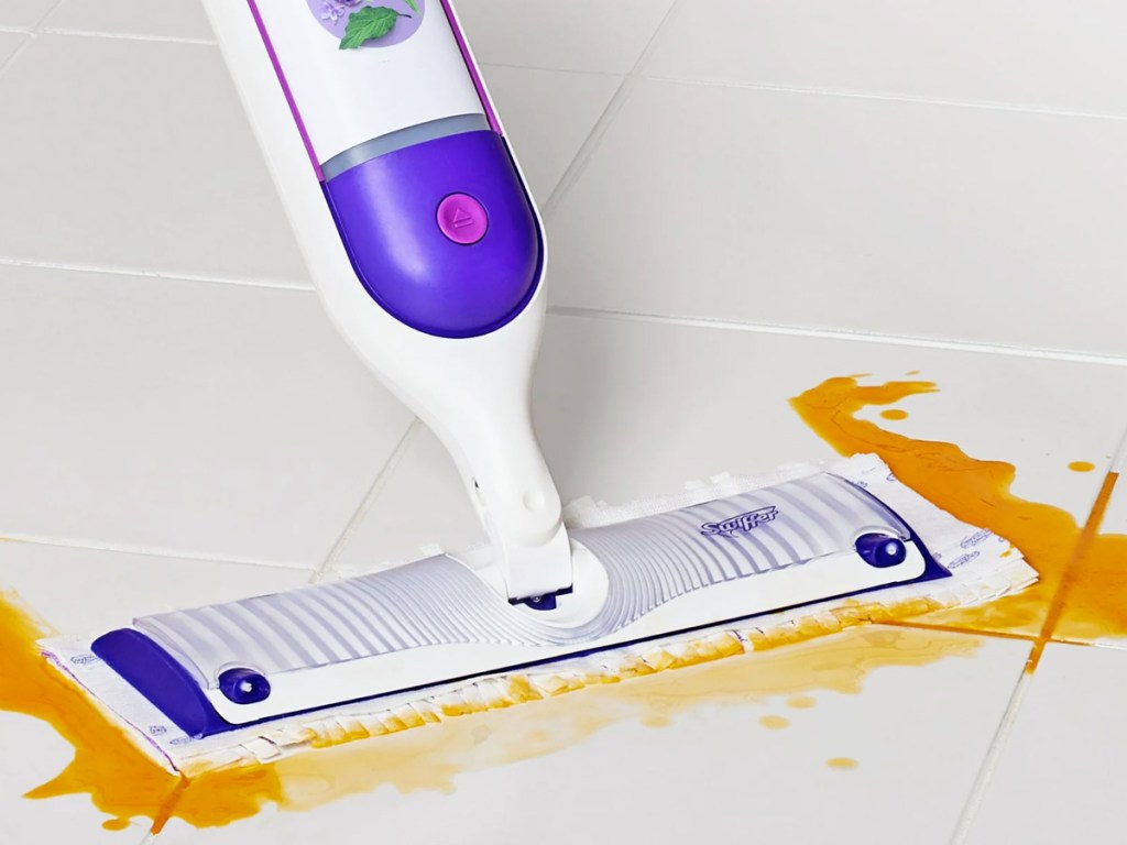 using Swiffer PowerMop to clean spill on tile floor
