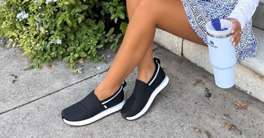 woman wearing TOMS Women's Resident Jogger 2.0 Slip-On Sneakers