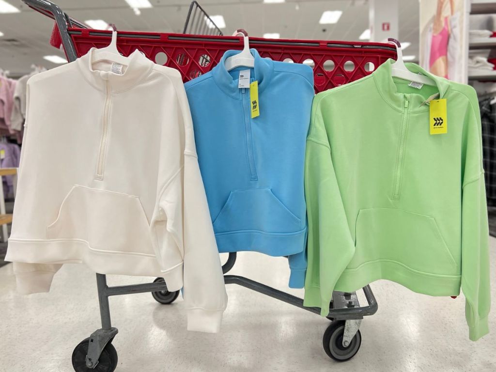 All in Motion Women's Pullovers hanging on a Target shopping cart