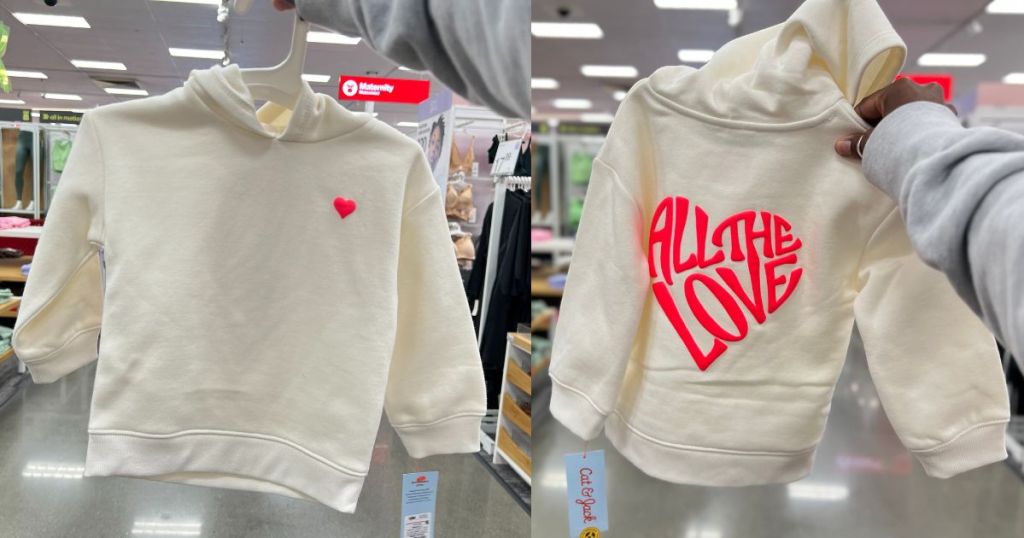 image showing front and back of a cream Valentine's toddler hoodie that has a heart on the front and the words "All the Love" on the back