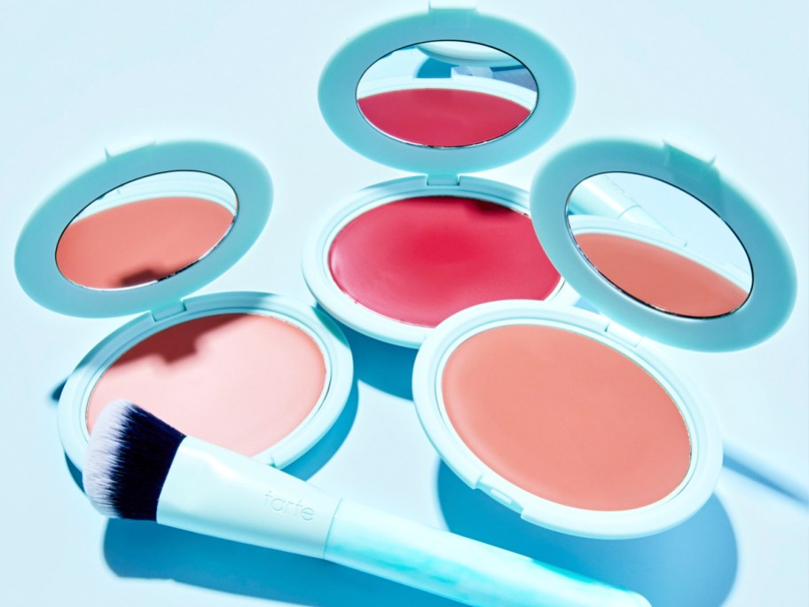 three opened compacts of cream blush in various shades
