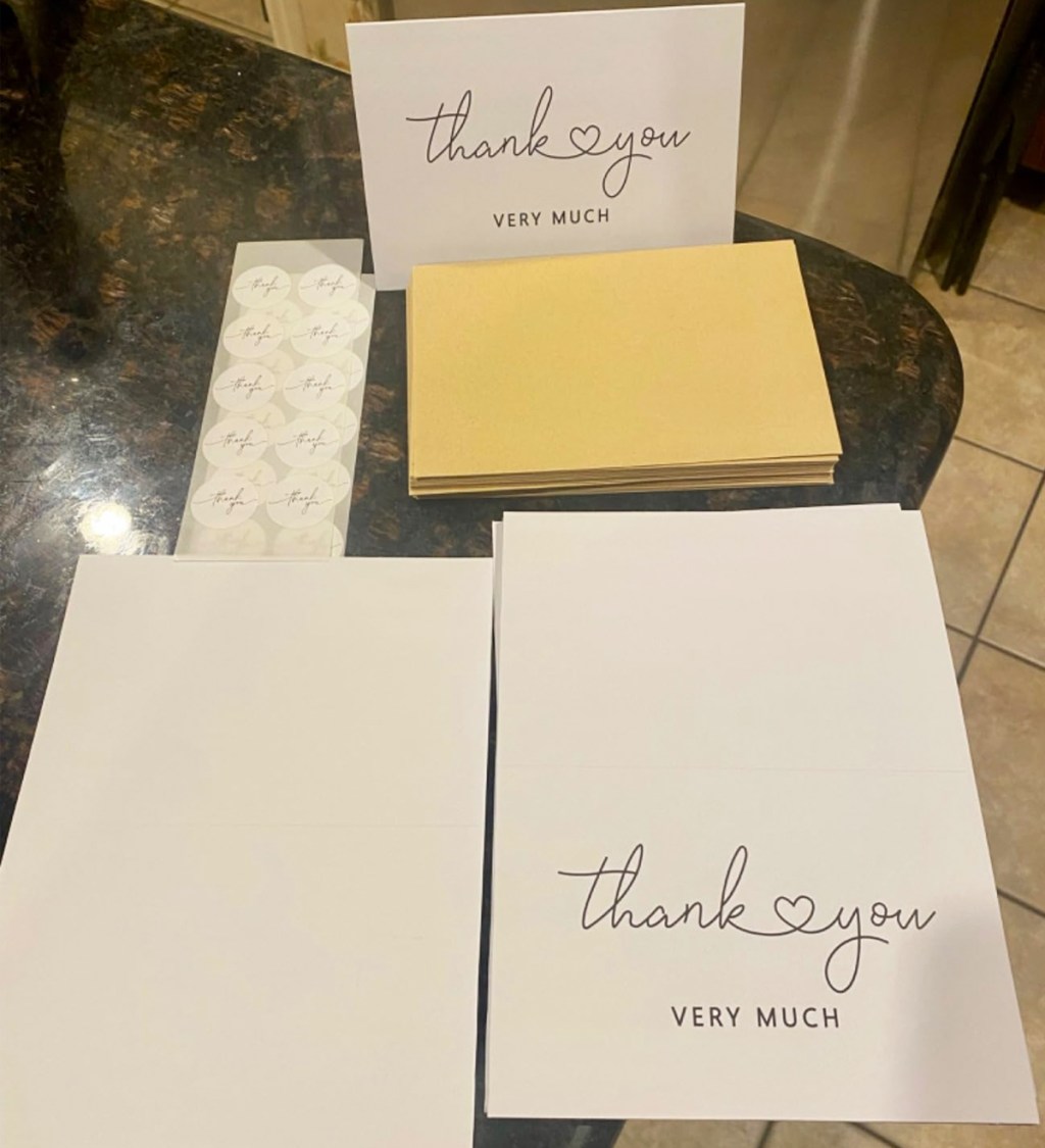 set of thank you cards, envelopes, and stickers on kitchen counter