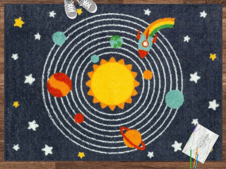 navy blue solar system print area rug