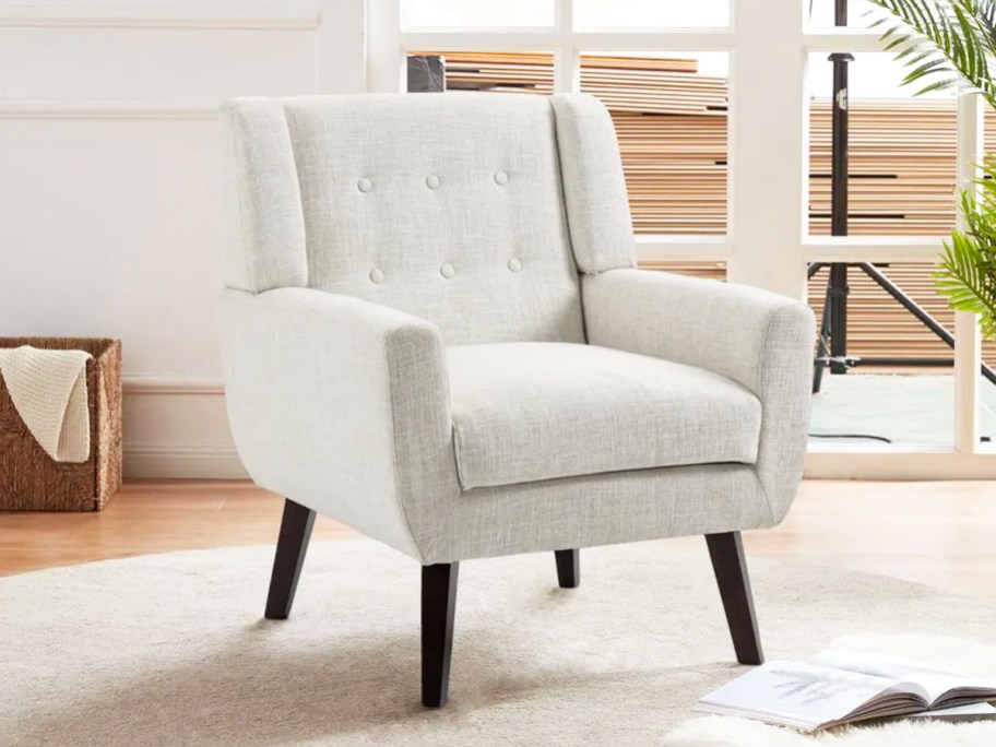 light grey linen accent chair in living room