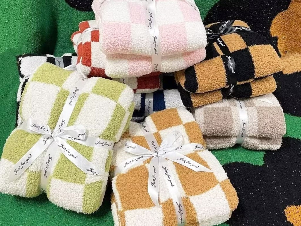 fuzzy checkered throw blankets tied with ribbons