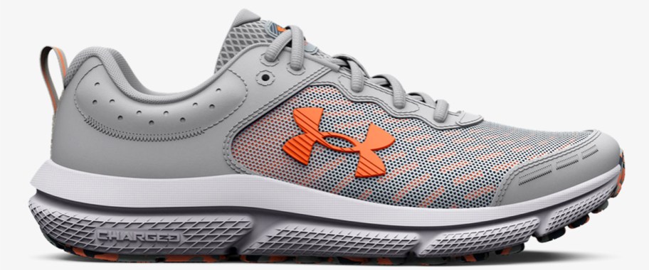 grey and orange under armour running shoe