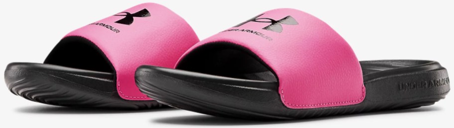 pair of pink and black under armour slides