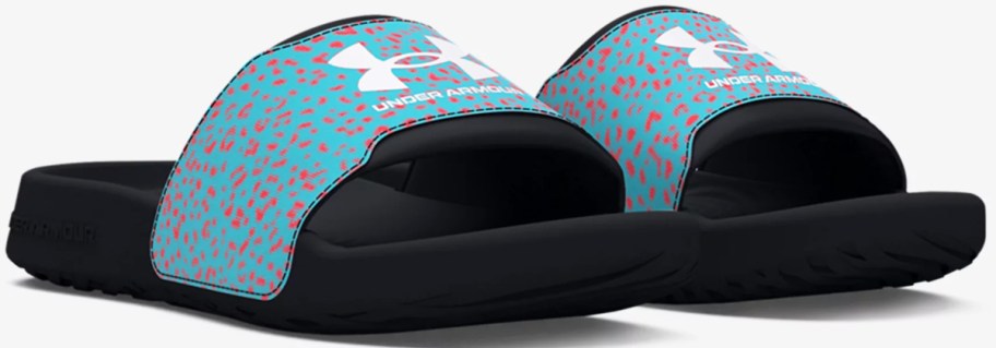 pair of blue and pink spotted under armour slides