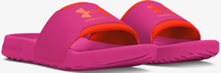 pair of pink and red under armour slides