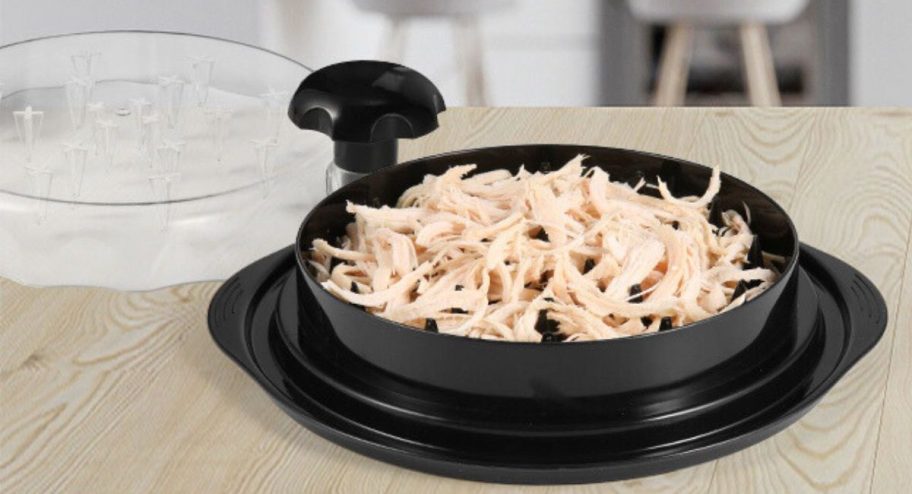 Upgrate Chicken Shredder on table with shredded chicken in it