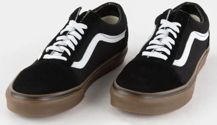 a pair of black gum sole vans