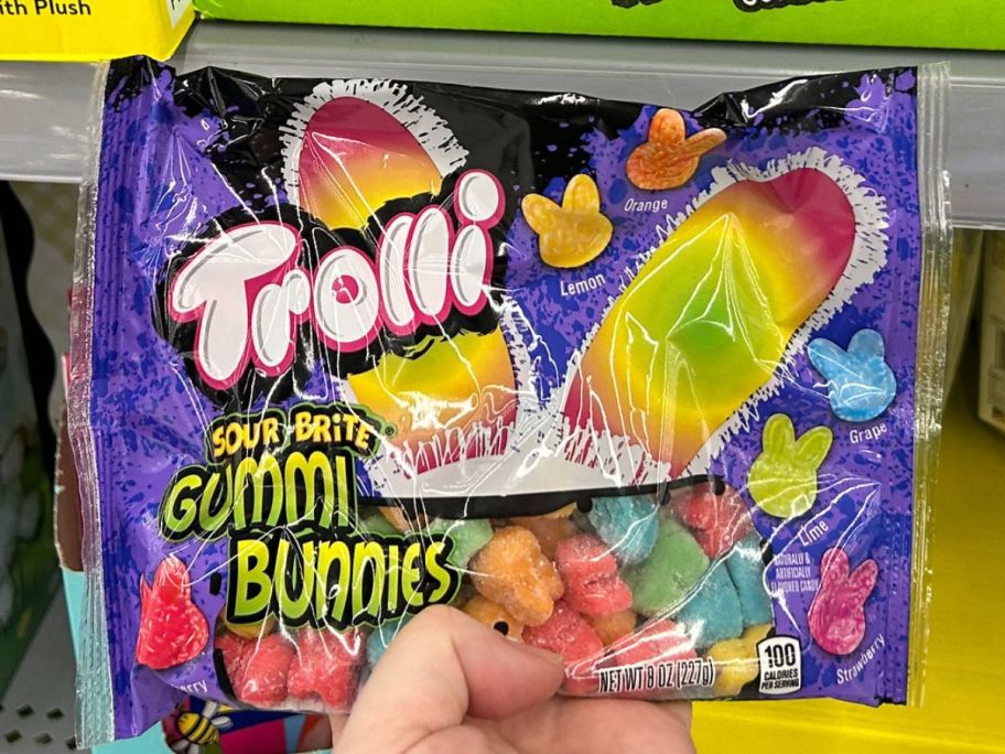 Hand holding a bag of Trolli Gummy Bunnies